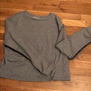 Glam sweater with fringe detail on sleeve